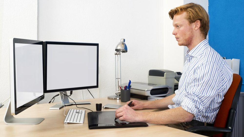 Dual Screen Person Working On The Computer